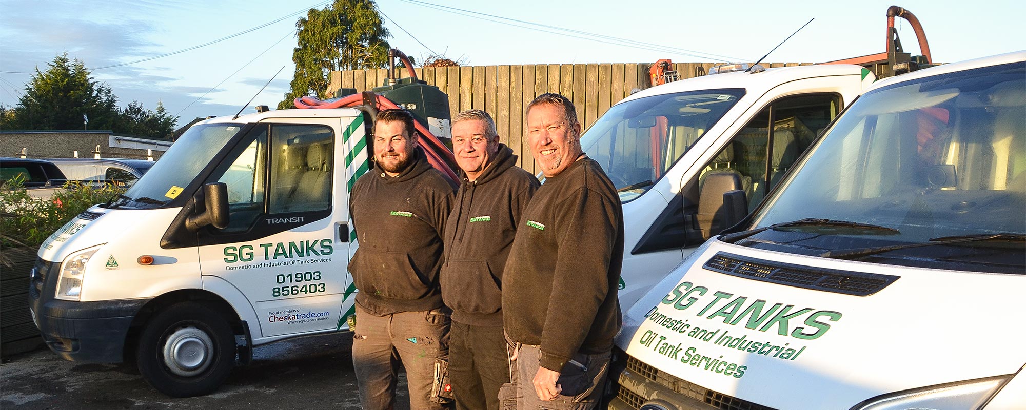 Team Standing In Front of Company Van